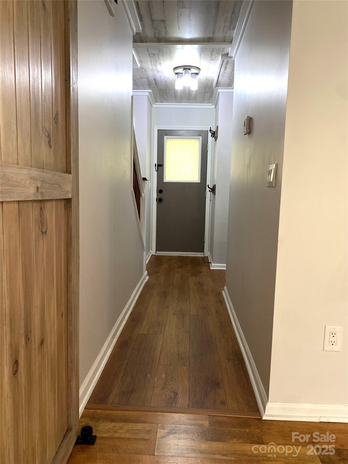 3 Rocking Porch Road Asheville, NC 28805 - Photo 11 of 25 a view of a hallway with wooden floor