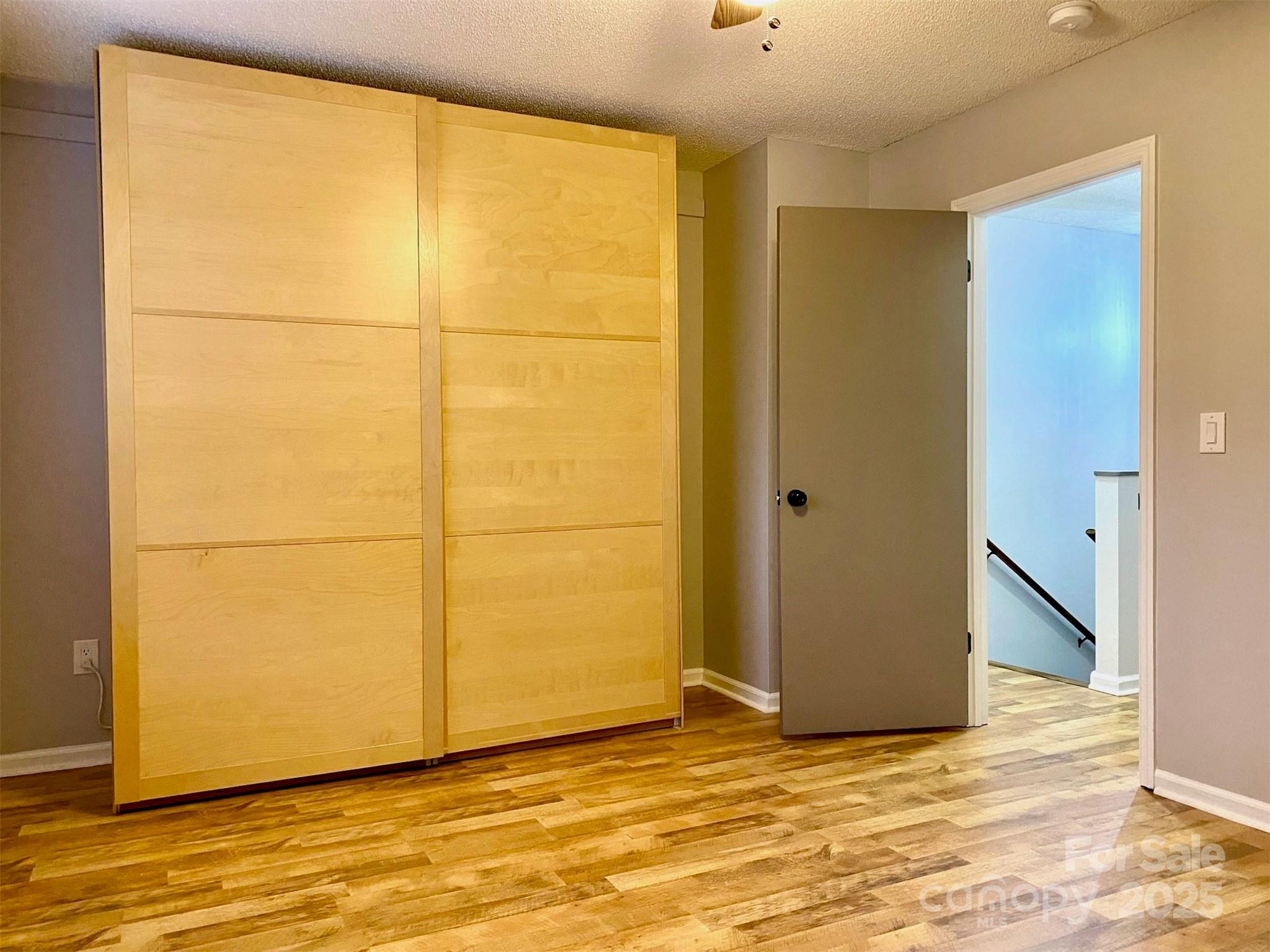 3 Rocking Porch Road Asheville, NC 28805 - Photo 18 of 25 a view of a room with wooden floor and cabinet