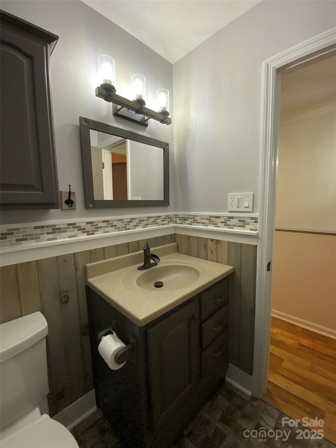 3 Rocking Porch Road Asheville, NC 28805 - Photo 23 of 25 a bathroom with a sink and a mirror