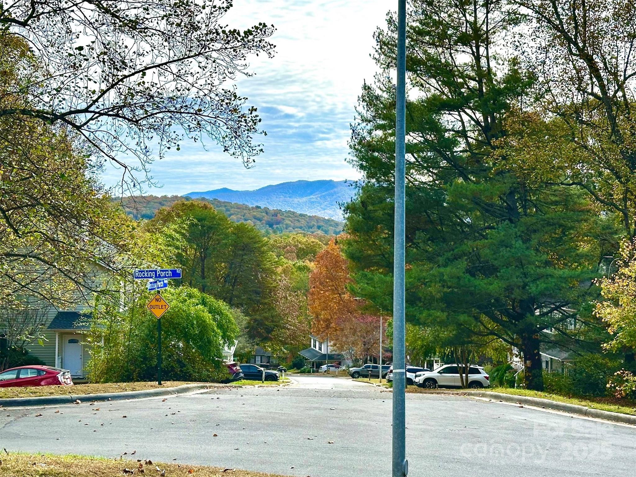 3 Rocking Porch Road Asheville, NC 28805 - Photo 6 of 25 a street sign next to a road