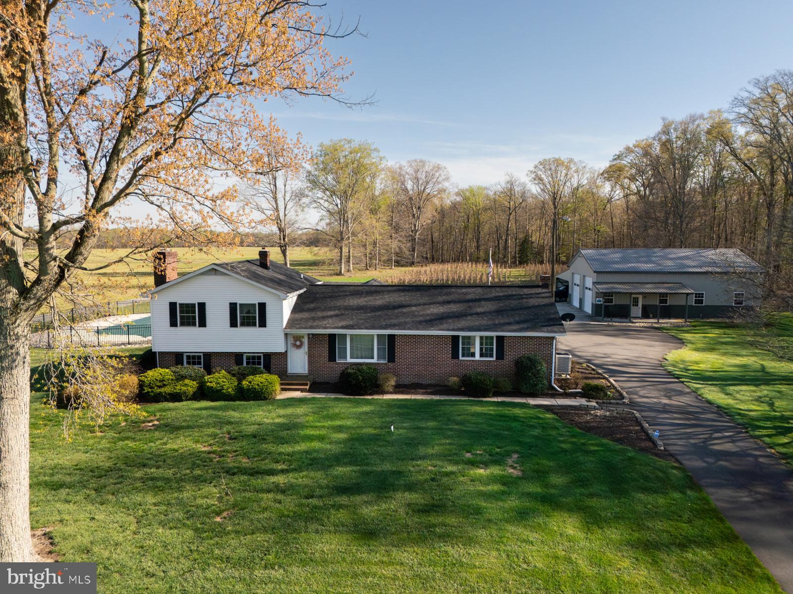 34203 Cypress Road Millington, MD 21651 - Photo 30 of 30 a front view of a house with a garden