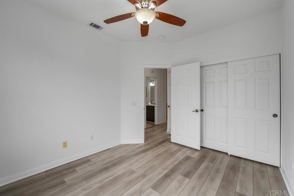 5511 Old Ranch Road, Unit 19 Oceanside, CA 92057 - Photo 21 of 32 a view of an empty room and chandelier fan