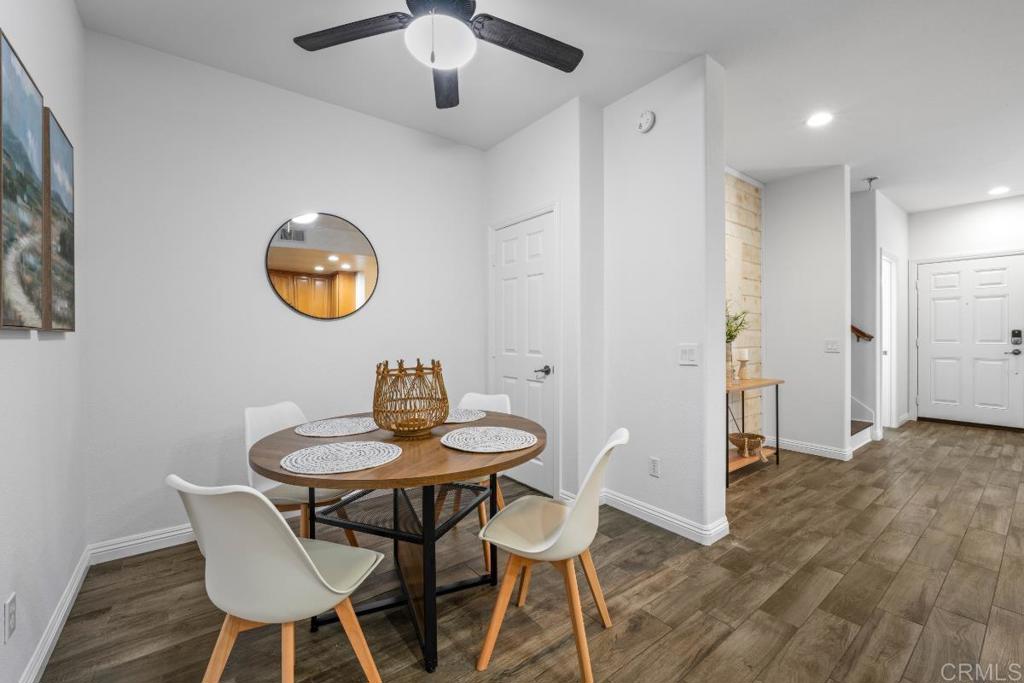 5511 Old Ranch Road, Unit 19 Oceanside, CA 92057 - Photo 10 of 32 a view of a dining room with furniture and wooden floor