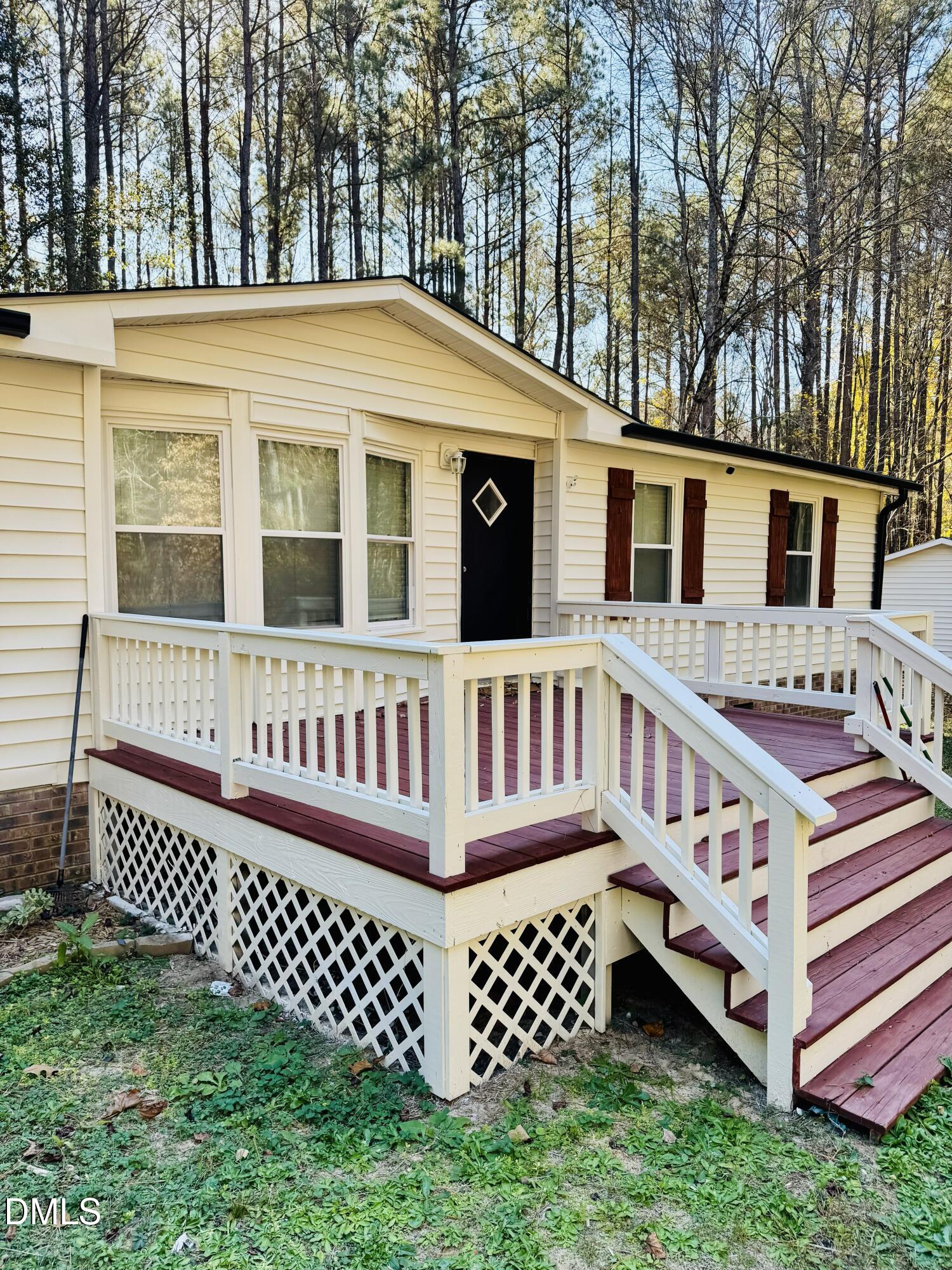 3280 Lakebay Road Vass, NC 28394 - Photo 2 of 41 a view of a house with wooden fence