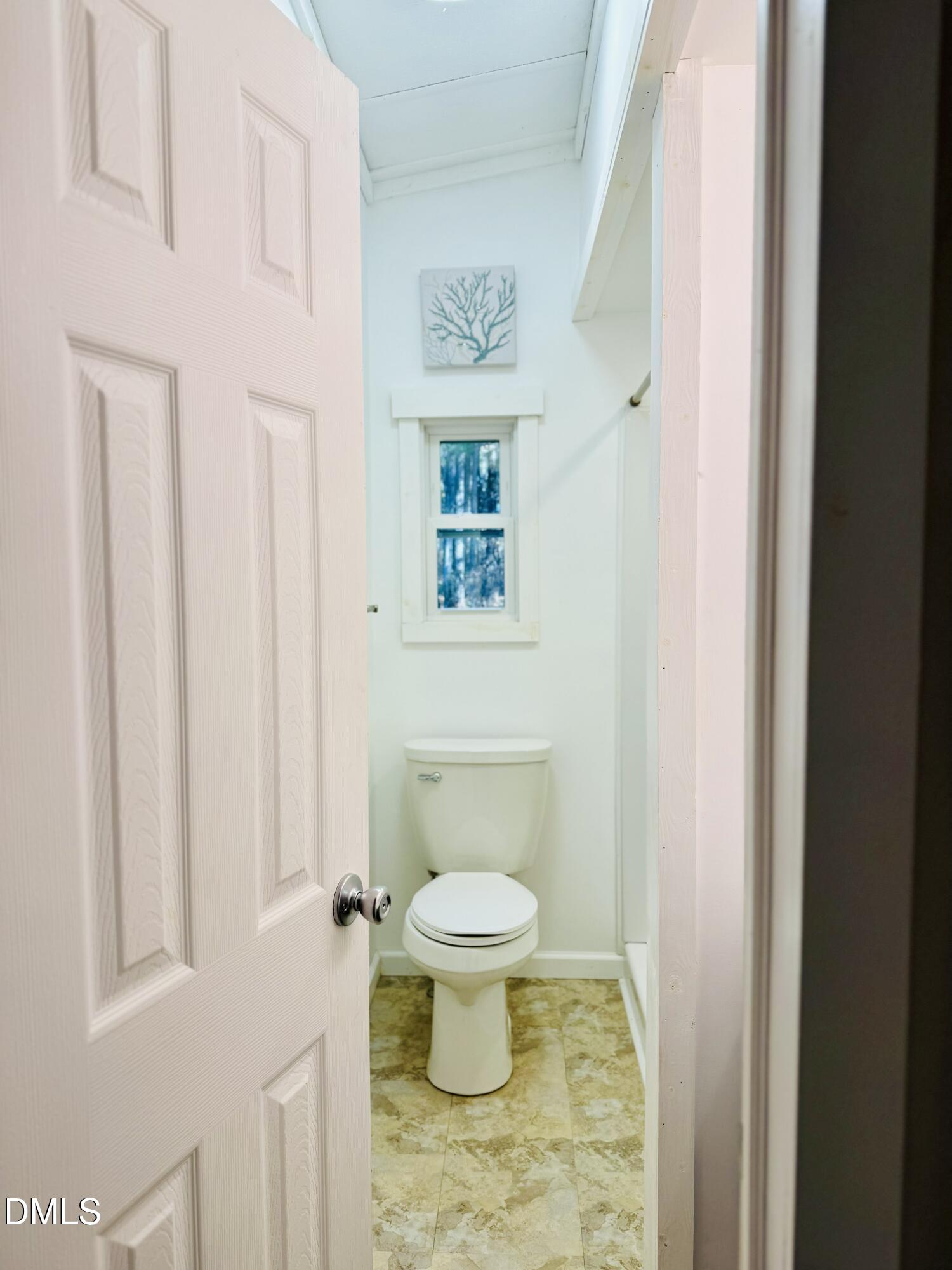 3280 Lakebay Road Vass, NC 28394 - Photo 23 of 41 a white toilet sitting next to a bathroom sink
