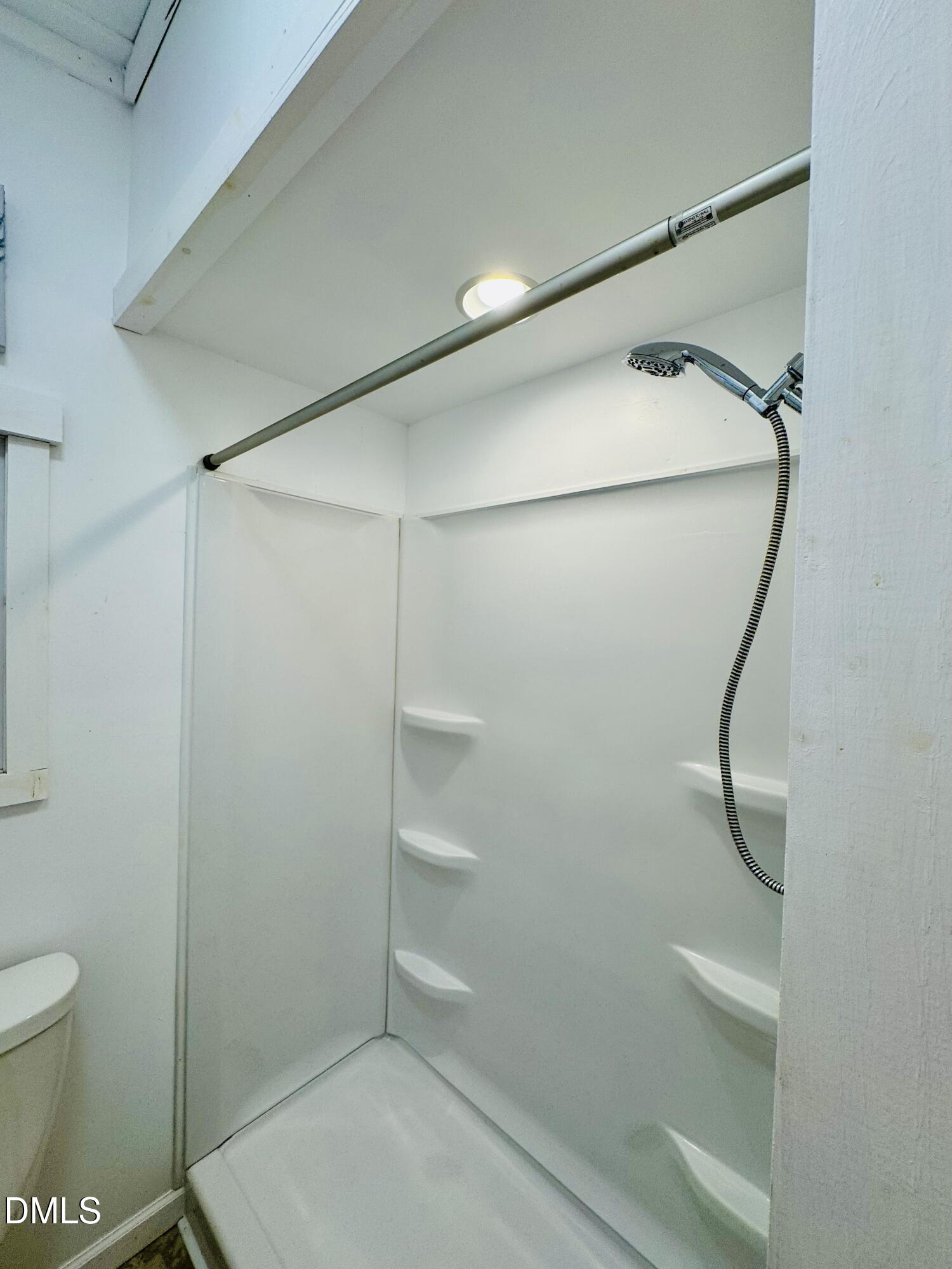 3280 Lakebay Road Vass, NC 28394 - Photo 25 of 41 a bathroom with a glass shower door