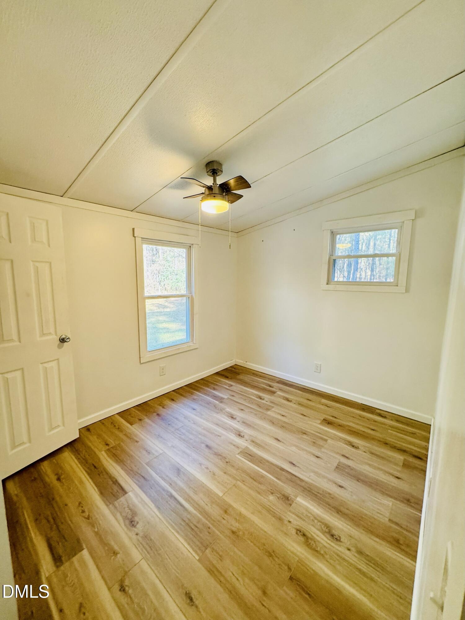 3280 Lakebay Road Vass, NC 28394 - Photo 27 of 41 a view of empty room with wooden floor