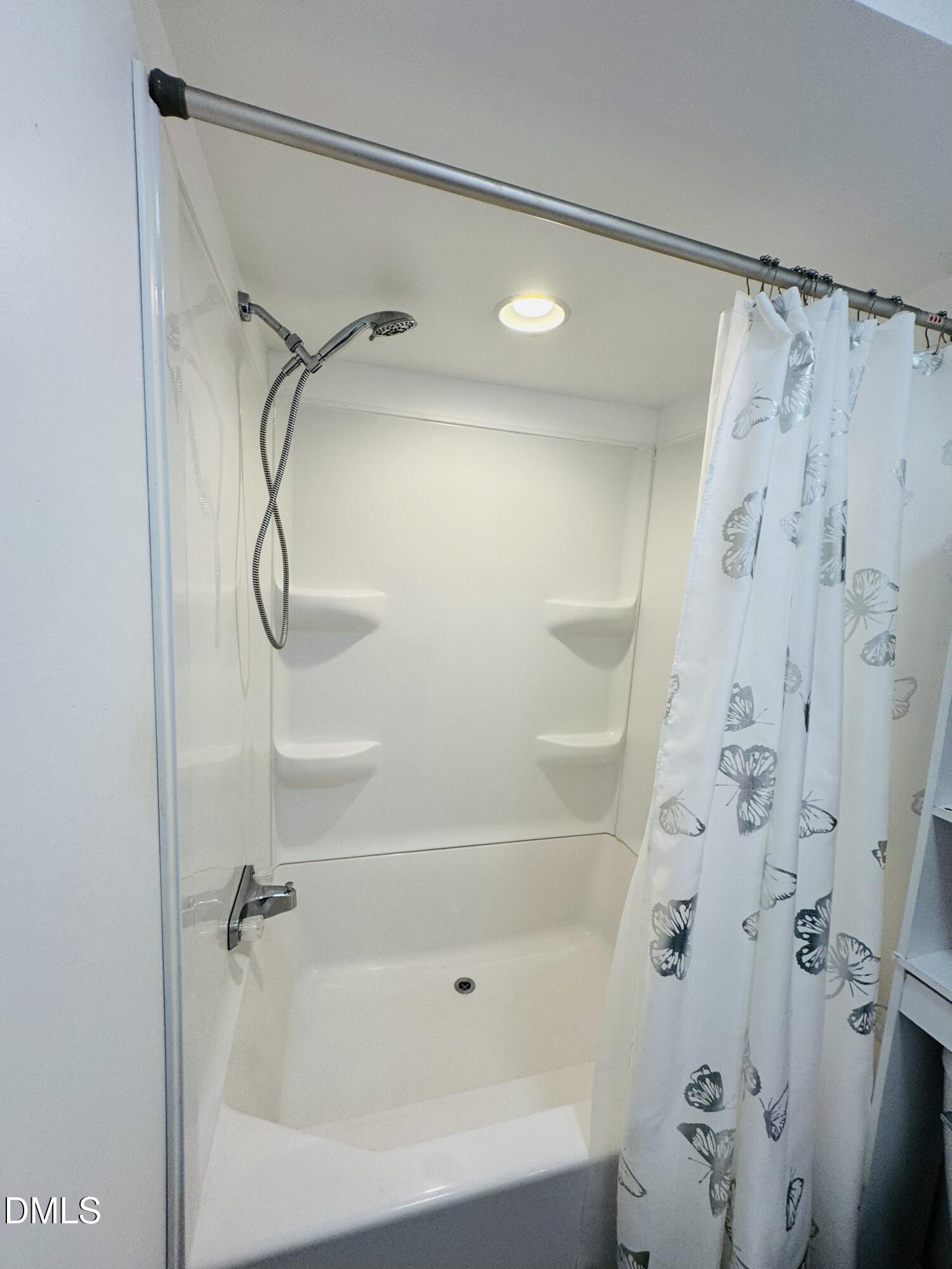 3280 Lakebay Road Vass, NC 28394 - Photo 33 of 41 a bathroom with a bathtub and a shower