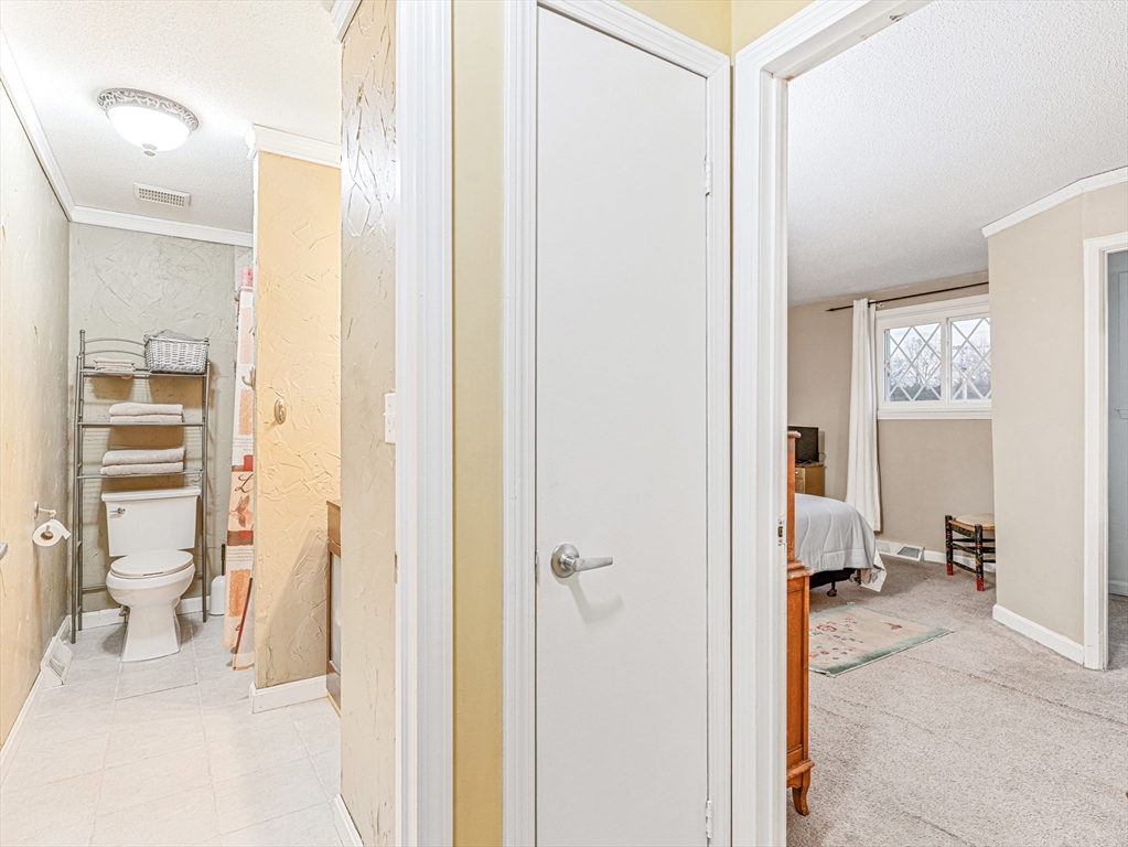 945 Riverside Drive, Unit 2A Methuen, MA 01844 - Photo 25 of 39 a view of a bedroom from a hallway
