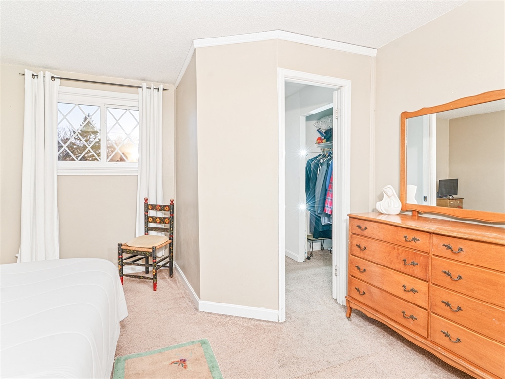 945 Riverside Drive, Unit 2A Methuen, MA 01844 - Photo 27 of 39 a spacious bathroom with a double vanity sink and a mirror