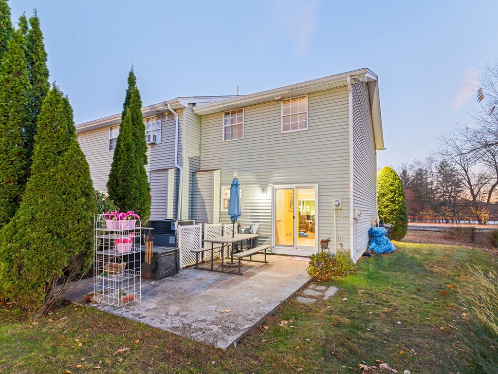 945 Riverside Drive, Unit 2A Methuen, MA 01844 - Photo 32 of 39 a view of a house with backyard and sitting area