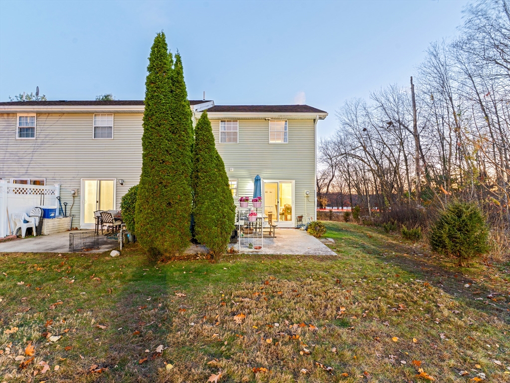945 Riverside Drive, Unit 2A Methuen, MA 01844 - Photo 33 of 39 a view of a house with backyard and trees