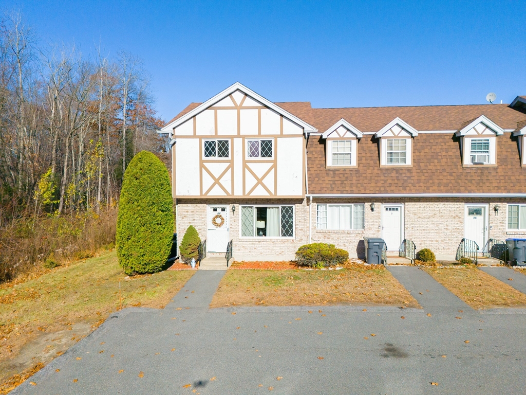 945 Riverside Drive, Unit 2A Methuen, MA 01844 - Photo 34 of 39 a front view of a house with a yard