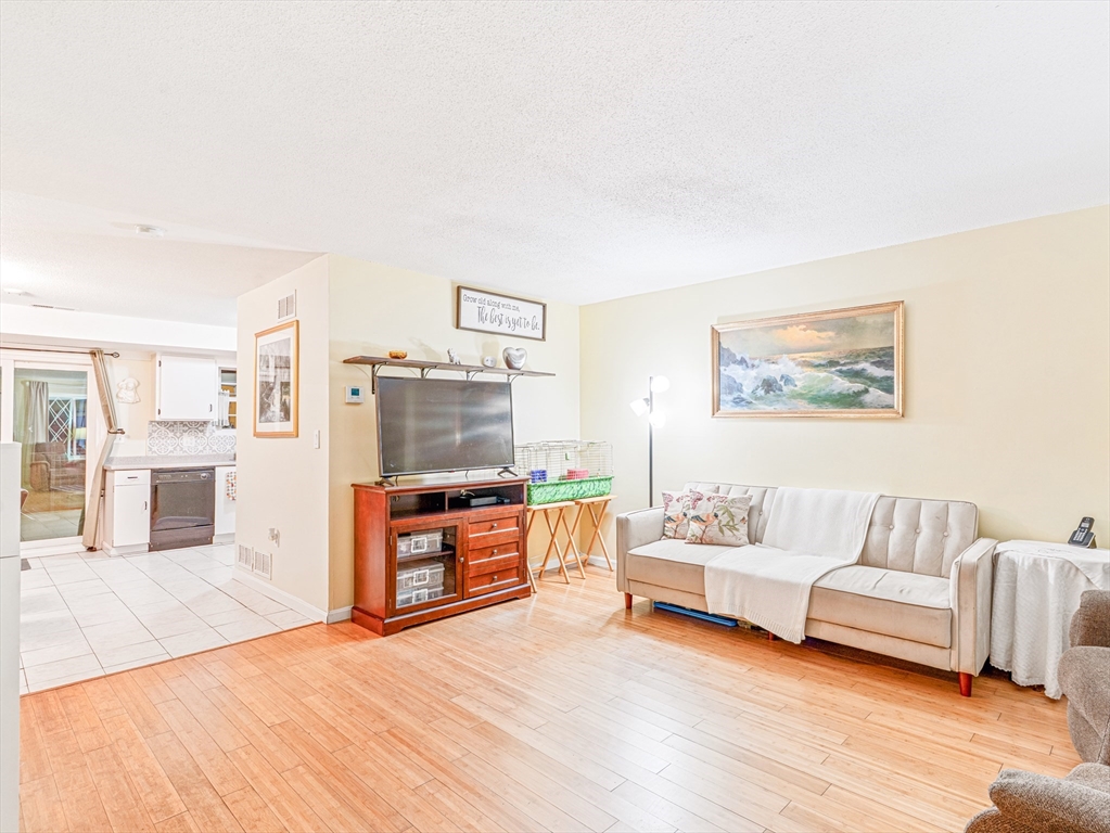 945 Riverside Drive, Unit 2A Methuen, MA 01844 - Photo 5 of 39 a living room with furniture and a flat screen tv