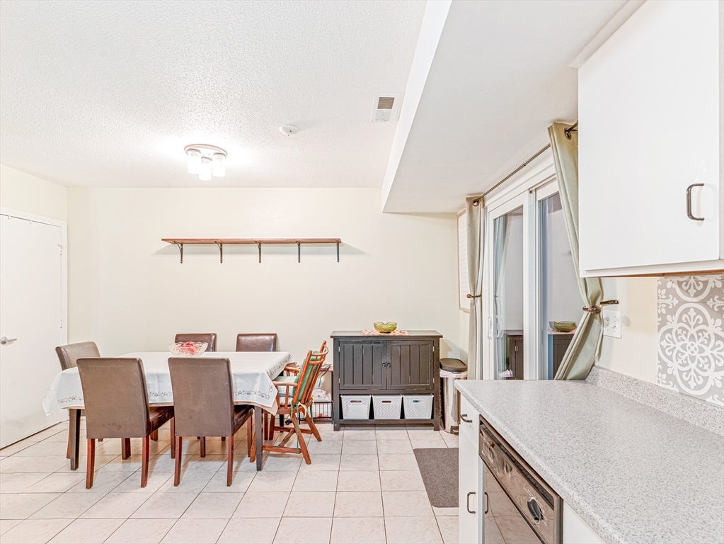 945 Riverside Drive, Unit 2A Methuen, MA 01844 - Photo 8 of 39 a view of a dining room with furniture and a table
