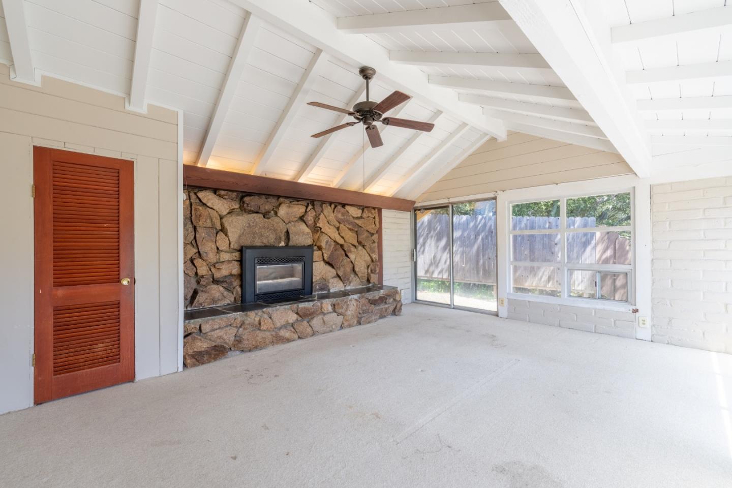 72 Los Laureles Grade Road Carmel Valley, CA 93924 - Photo 6 of 43 en empty room with windows and fireplace