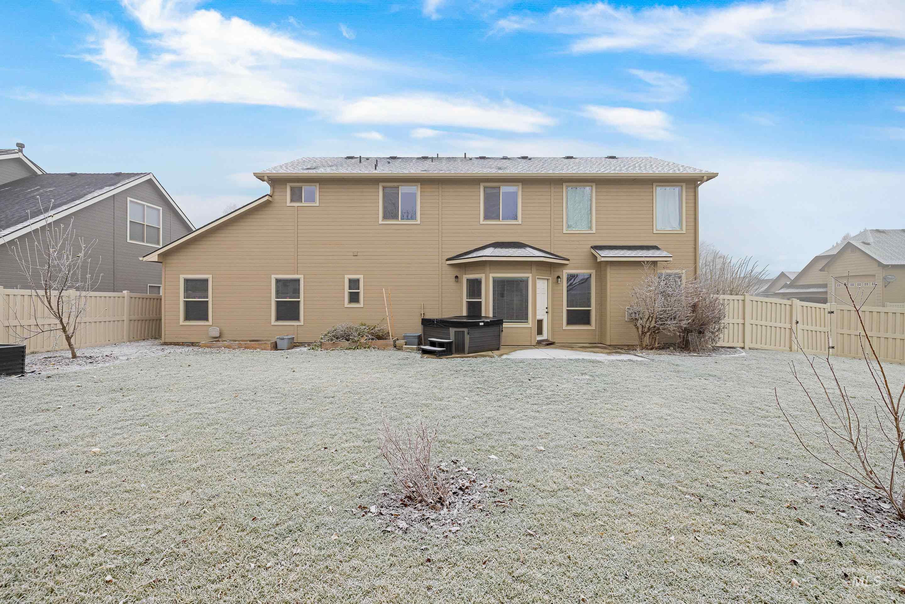 2578 South Groom Way Meridian, ID 83642 - Photo 36 of 39 Rear view of property with a patio, a fenced backyard, and a hot tub