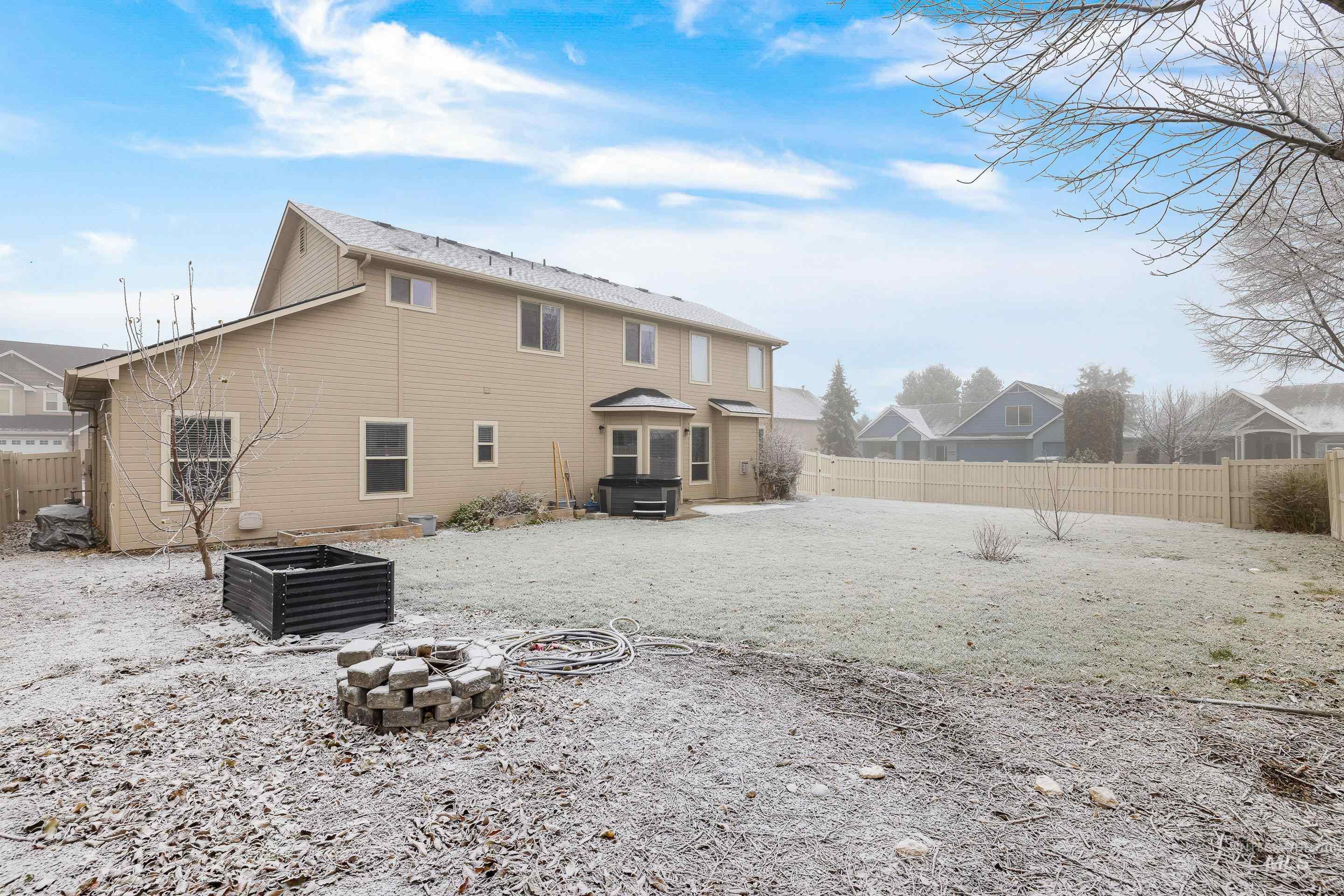 2578 South Groom Way Meridian, ID 83642 - Photo 37 of 39 Back of property with a patio, a fenced backyard, and a fire pit