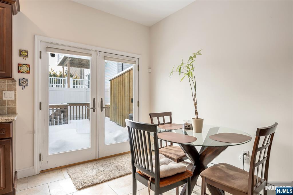 682 Greeley Avenue, Unit A Fairview, NJ 07022 - Photo 12 of 23 a view of a dining room with furniture and wooden floor