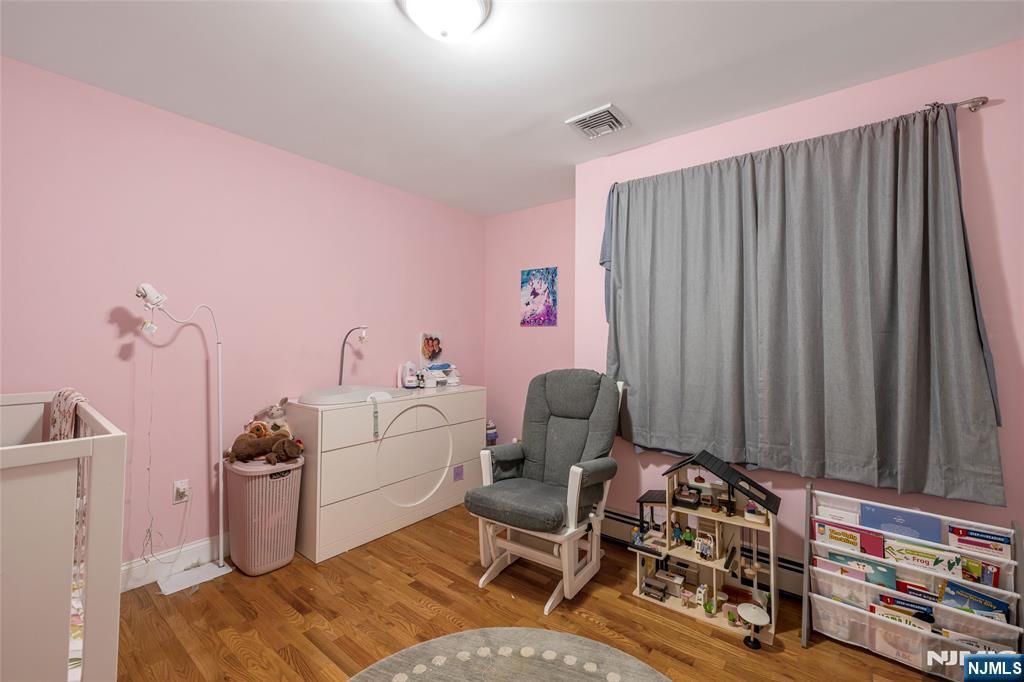 682 Greeley Avenue, Unit A Fairview, NJ 07022 - Photo 19 of 23 a livingroom with furniture and a rug