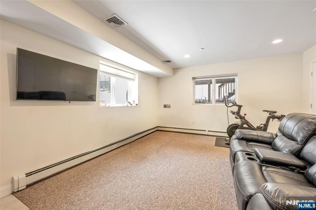 682 Greeley Avenue, Unit A Fairview, NJ 07022 - Photo 20 of 23 a view of livingroom with furniture and flat screen tv