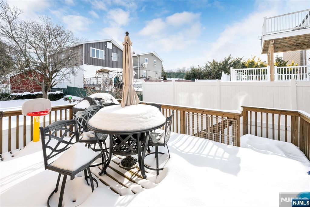 682 Greeley Avenue, Unit A Fairview, NJ 07022 - Photo 23 of 23 a view of a chairs and table in the patio
