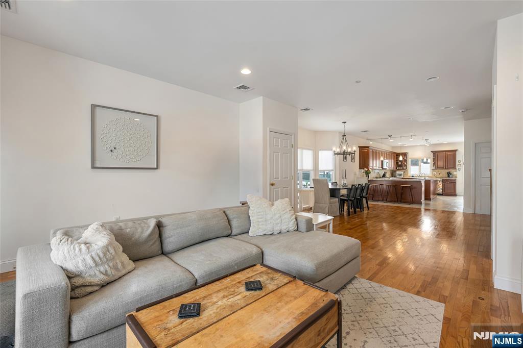 682 Greeley Avenue, Unit A Fairview, NJ 07022 - Photo 4 of 23 a living room with furniture and a view of kitchen