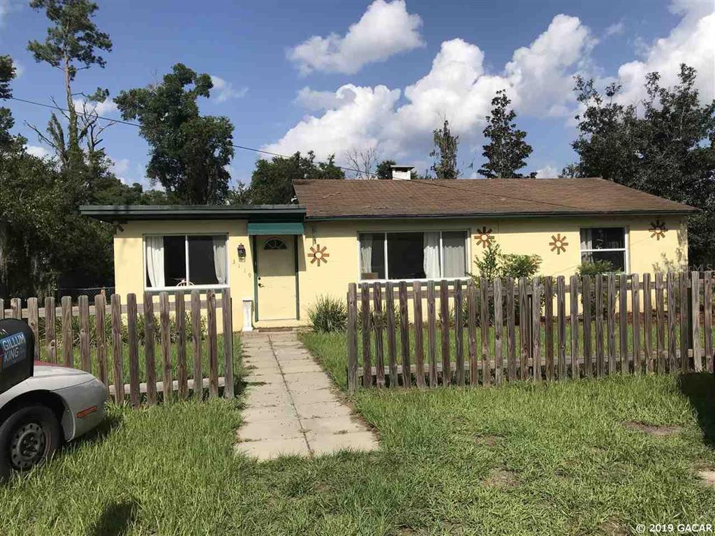 3119 Northwest 4th Street Gainesville, FL 32609 - Photo 1 of 1 a front view of a house with a garden