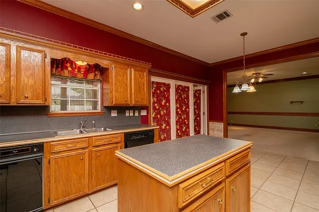 a view of a livingroom with a ceiling fan and window