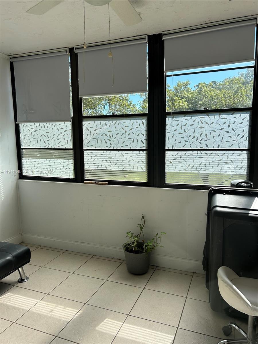 200 Gate Road, Unit 207 Hollywood, FL 33024 - Photo 15 of 38 a bathroom with a toilet and a shower