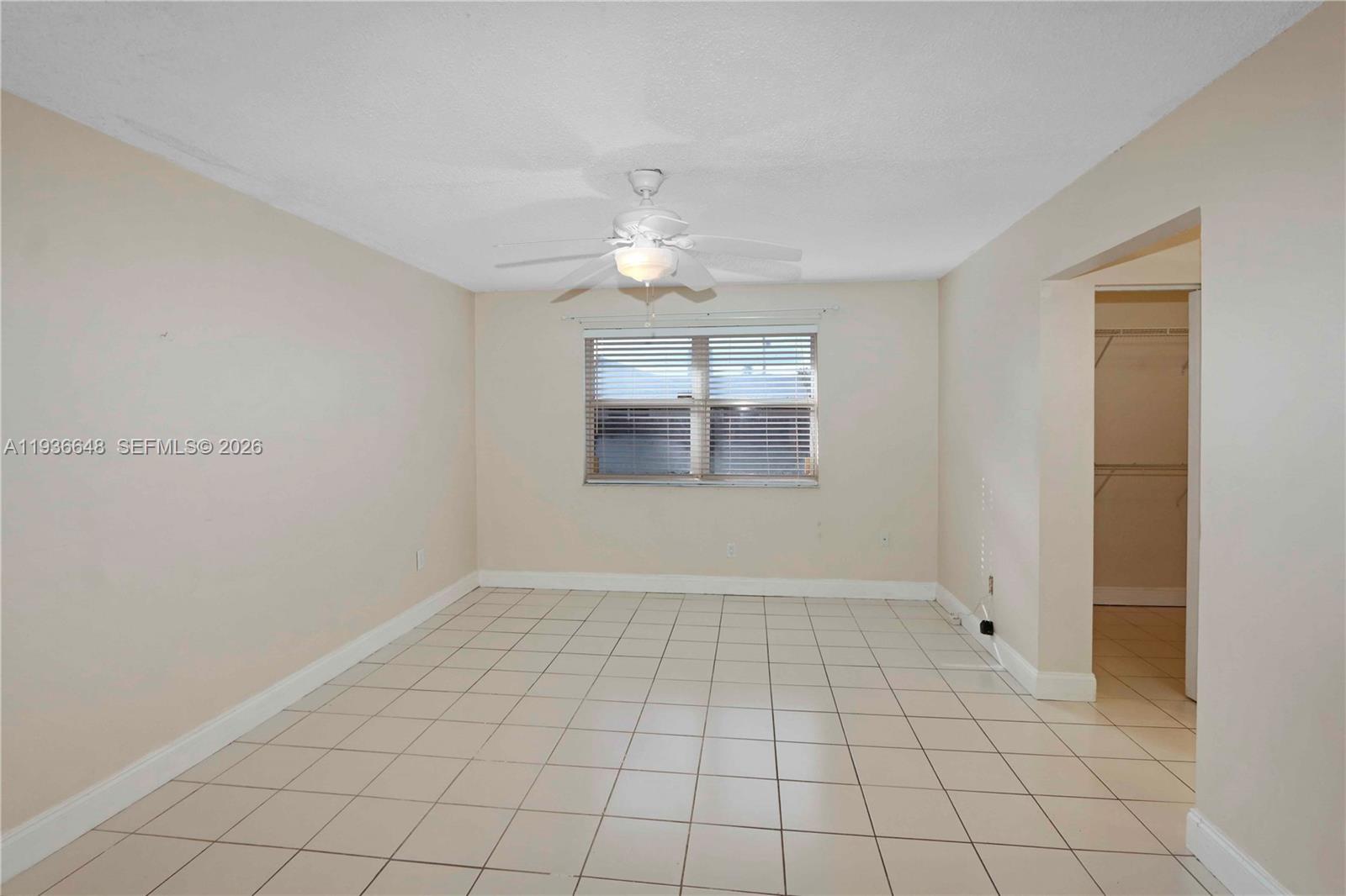 13244 Southwest 255th Terrace Homestead, FL 33032 - Photo 12 of 22 a view of an empty room with window