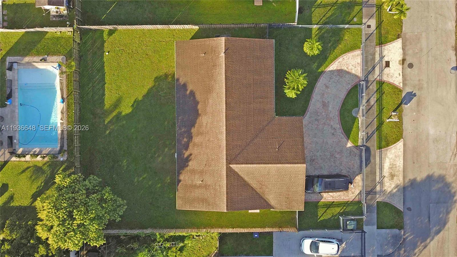 13244 Southwest 255th Terrace Homestead, FL 33032 - Photo 4 of 22 an aerial view of a house with a swimming pool