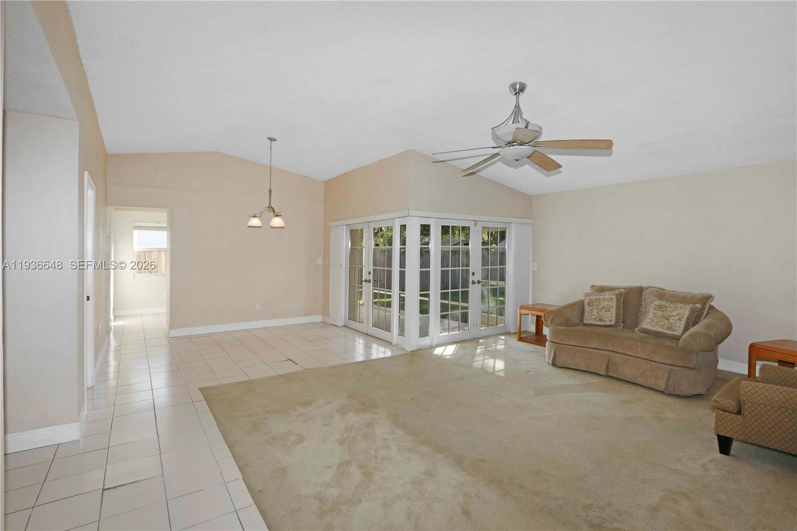13244 Southwest 255th Terrace Homestead, FL 33032 - Photo 6 of 22 a living room with furniture and windows