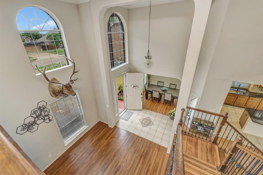 2312 Tawny Owl Road Grand Prairie, TX 75052 - Photo 23 of 40 Entrance foyer featuring light wood-style floors and a high ceiling