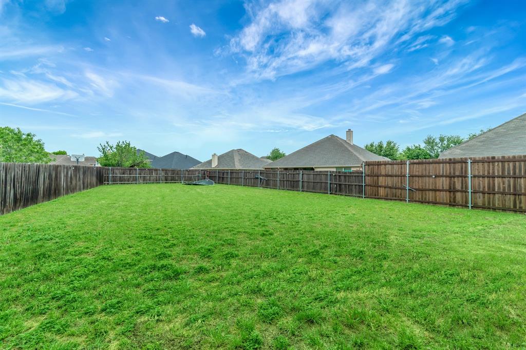2312 Tawny Owl Road Grand Prairie, TX 75052 - Photo 34 of 40 View of fenced backyard