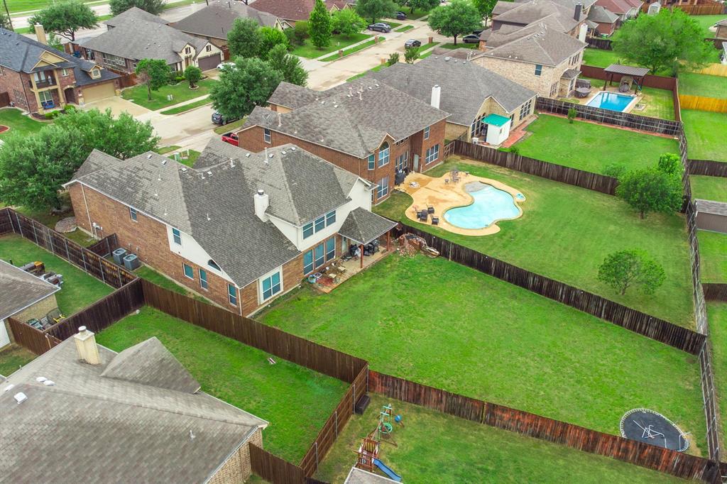2312 Tawny Owl Road Grand Prairie, TX 75052 - Photo 38 of 40 Aerial view of residential area featuring a pool