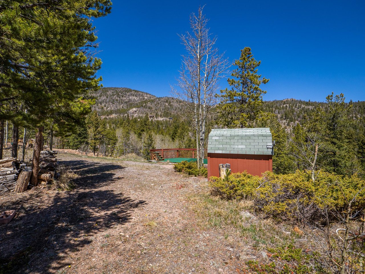 20 Inca Court Red Feather Lakes, CO 80545 - Photo 20 of 23 a front view of a house with a yard