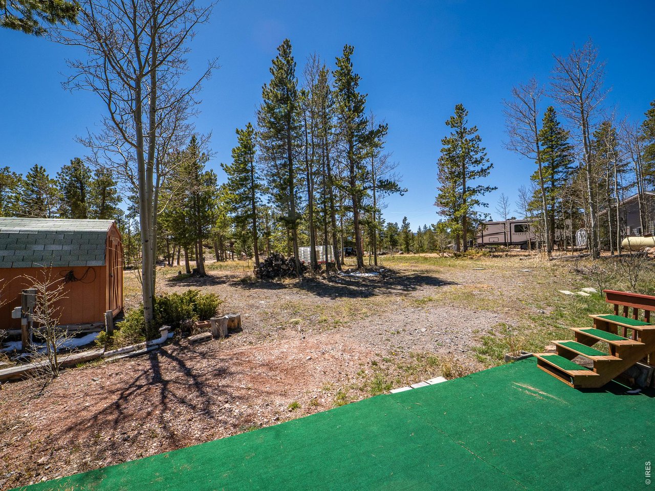 20 Inca Court Red Feather Lakes, CO 80545 - Photo 3 of 23 a view of backyard with outdoor seating and trees