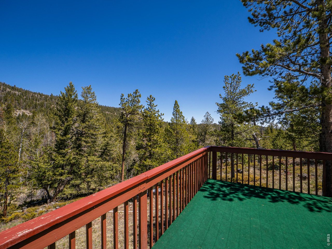 20 Inca Court Red Feather Lakes, CO 80545 - Photo 10 of 23 a view of a wooden deck with a yard
