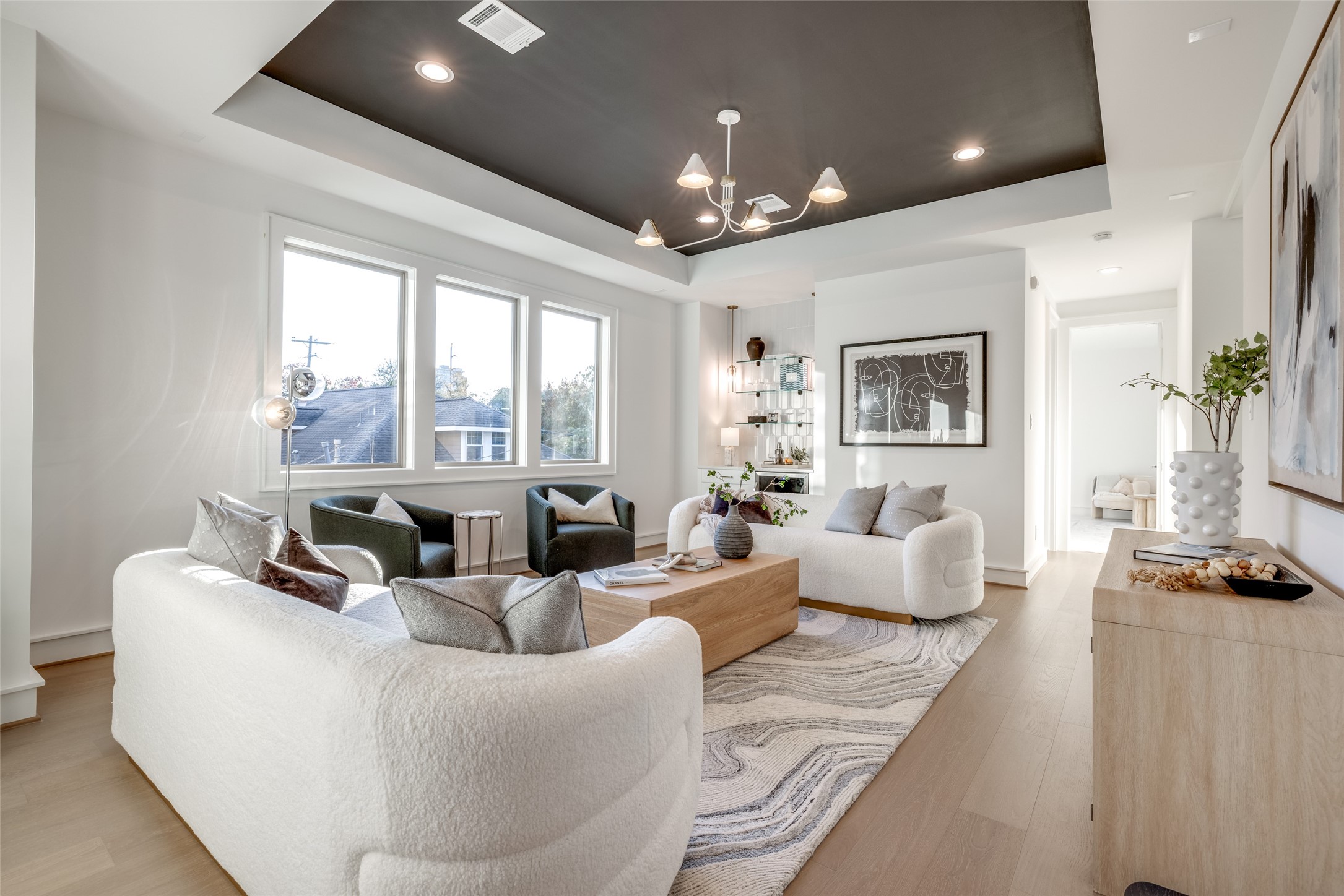 2213 Whitney Street Houston, TX 77006 - Photo 27 of 46 a living room with furniture and a chandelier