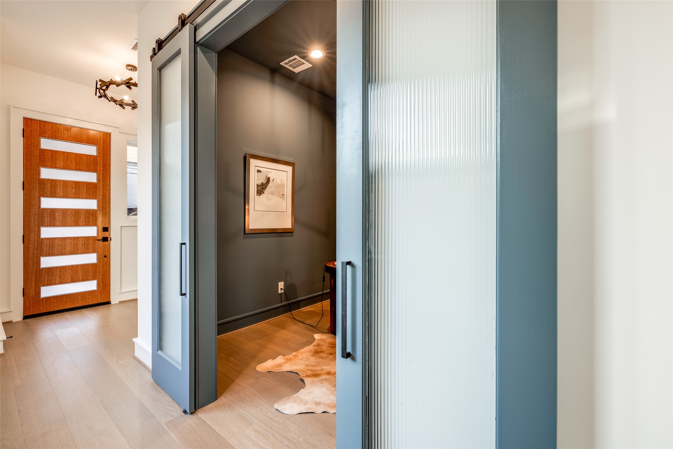 2213 Whitney Street Houston, TX 77006 - Photo 5 of 46 a view of a hallway with wooden floor and closet