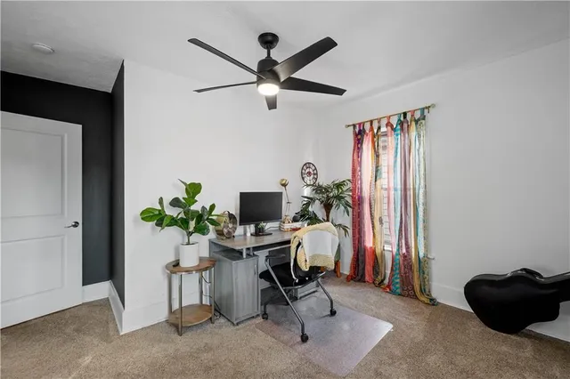 a workspace with furniture and a window