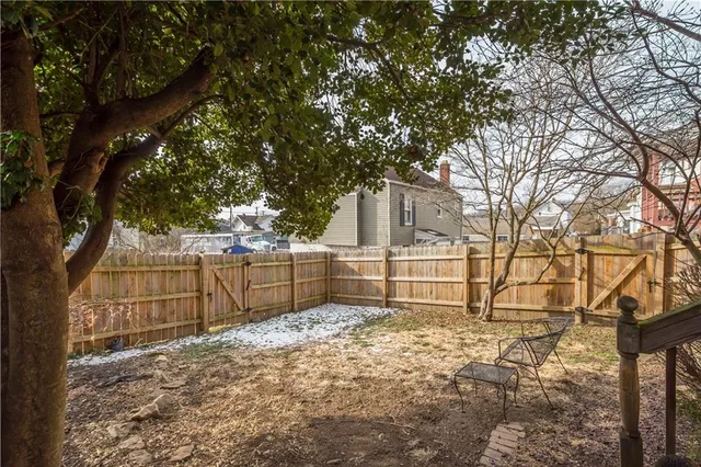 a backyard of a house with lots of tree