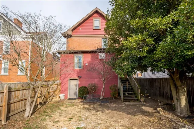a backyard of a house with shaded area