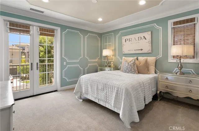 a bed room with a bed and a large window