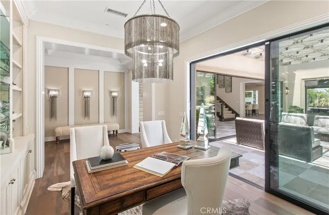 a living room with a table and chairs