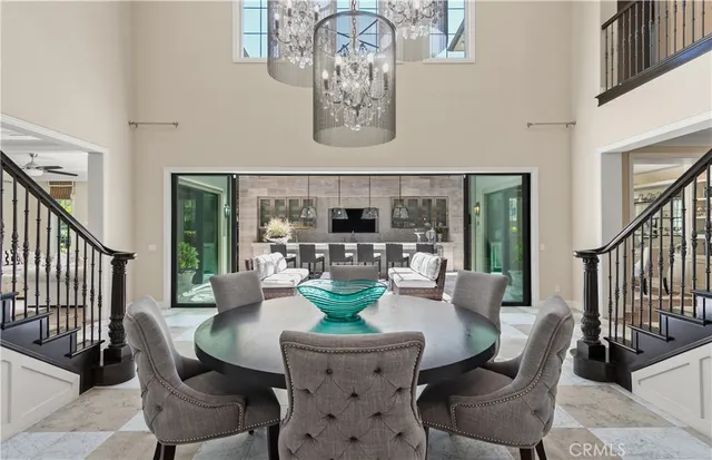 a dining room with furniture a fireplace and wooden floor