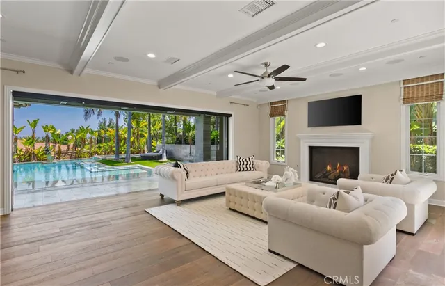 a living room with furniture fireplace and flat screen tv