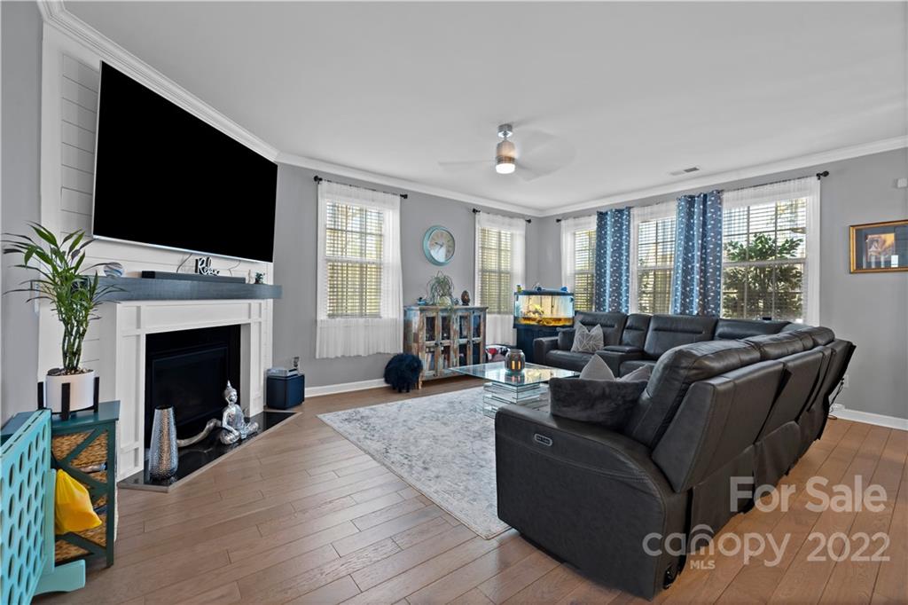 1908 Chatooka Lane Waxhaw, NC 28173 - Photo 20 of 47 a living room with furniture a fireplace and a flat screen tv