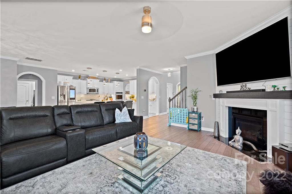 1908 Chatooka Lane Waxhaw, NC 28173 - Photo 21 of 47 a living room with furniture a flat screen tv and a fireplace